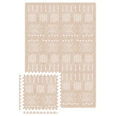 MOON WALKERS beige aztec design tiles offer a soft tummy-time surface.