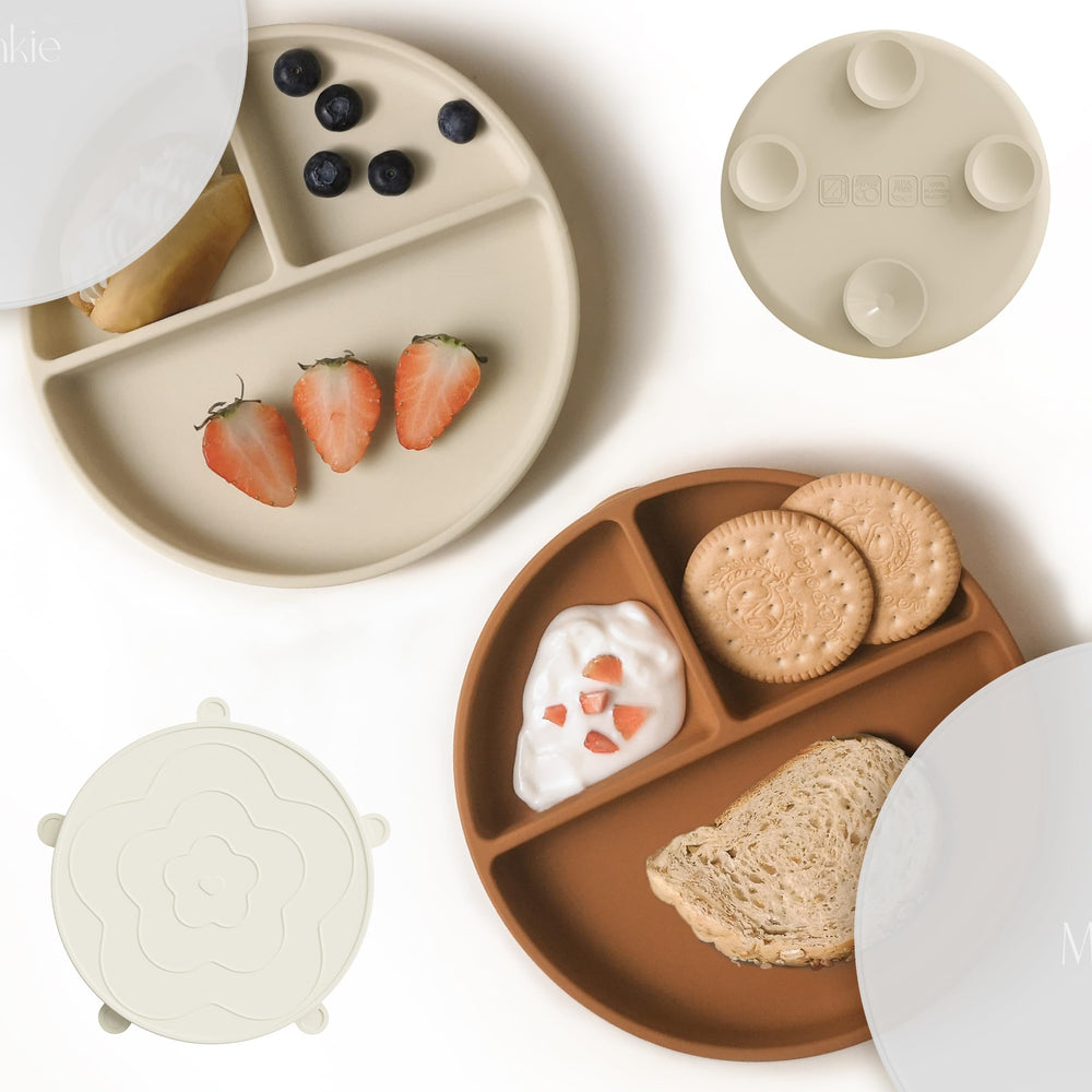 Moonkie suction plates baby closeup showing four-point suction for mess-free self-feeding