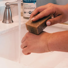Motherlove Baby & All Soap ingredient list emphasizes organic, plant-based cleansing with honey and oats