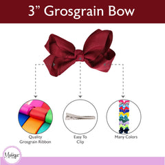 Motique Burgundy bow worn in hair creates bright, eye-catching detail.