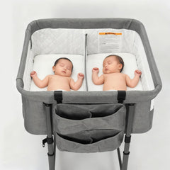 MTWML twin bassinet next to bed shows close monitoring setup for twins
