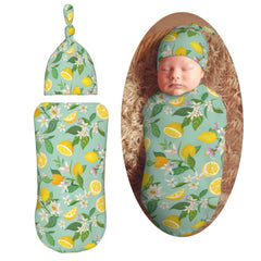Muishi flowers with lemon swaddle blanket closeup highlights soft, skin-friendly fabric.