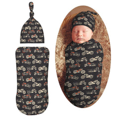 Muishi motorcycles-on-black-background swaddle blanket close-up shows soft, skin-friendly fabric for cozy newborn moments.