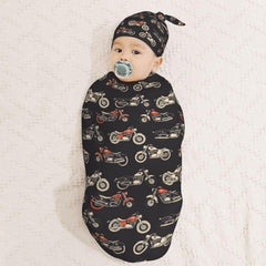 Muishi motorcycles-on-black-background swaddle blanket close-up demonstrates softness and warmth for newborns.