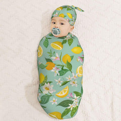 Muishi swaddle blanket flat lay showcases cozy cocoon design.