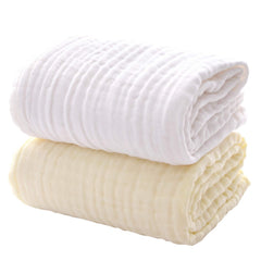 MUKIN baby towels white-yellow stack shows ultra-soft cotton and quick absorbency.