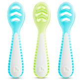 Munchkin Gentle Dip Stage 1 green spoon for early puree pickup and self-feeding.