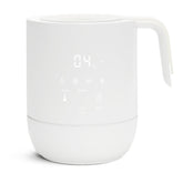 Munchkin Precision bottle warmer with digital display showing quick, uniform warming for breastmilk and formula.