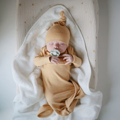 Mushie baby hooded towel pearl flat-lay to highlight dimensions 30.5 by 30.5 inches.
