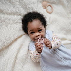 Mushie wearable blanket in crib-safety setup highlights reduced tangling during naps