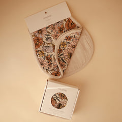 Mushie burp cloths fog folded; breathable fabric supports gentle daily feeds.