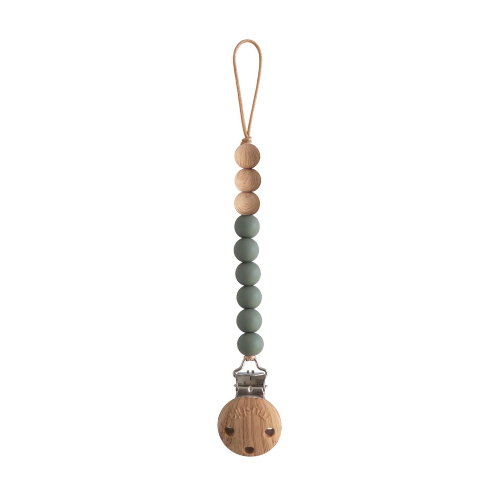 Mushie Eva pacifier clip dried thyme close-up for on-the-go access