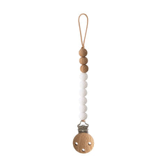 Mushie Eva pacifier clip with white beads keeps pacifier secure on the go