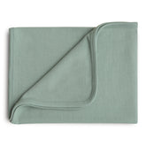 Mushie Extra Soft Baby Blanket in Roman Green ribbed cotton ready for swaddling and cuddling