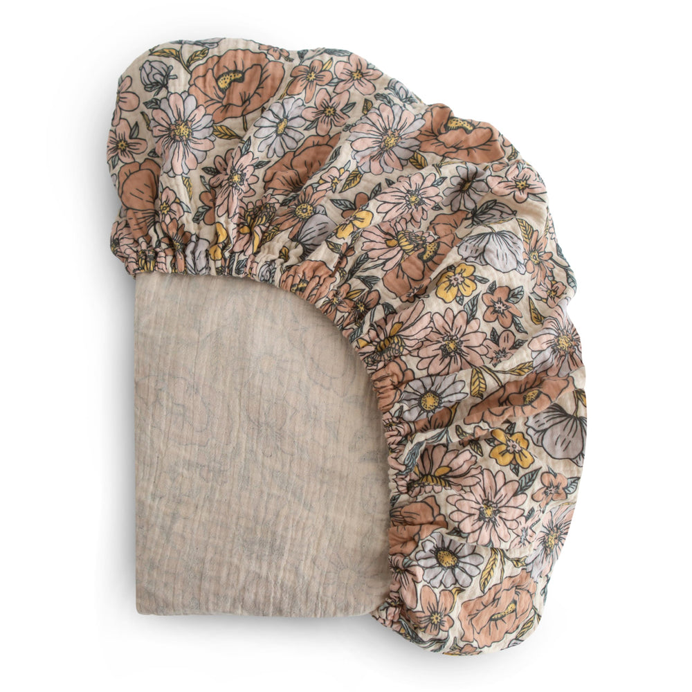 Mushie extra-soft muslin crib sheet in retro flowers, gentle on baby skin