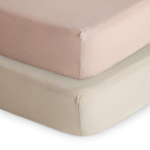 Mushie extra-soft muslin fitted crib sheet two-pack in blush and fog.