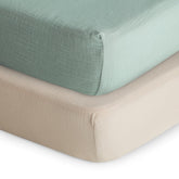 Mushie extra-soft muslin fitted crib sheet in Roman Green for gentle skin comfort.