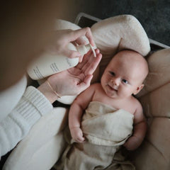 Mushie green lemon bath time water drops emphasize safe, everyday cleansing.