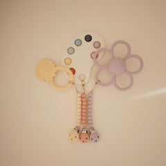 Mushie Hera pacifier clip screwless clasp for simple attachment.