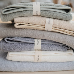 Mushie hooded towel blue flat lay highlighting color and size