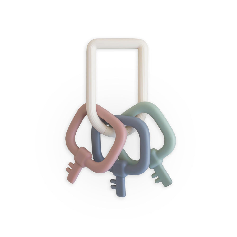 mushie Key Toy closeup in soothing colors for calming sensory play.