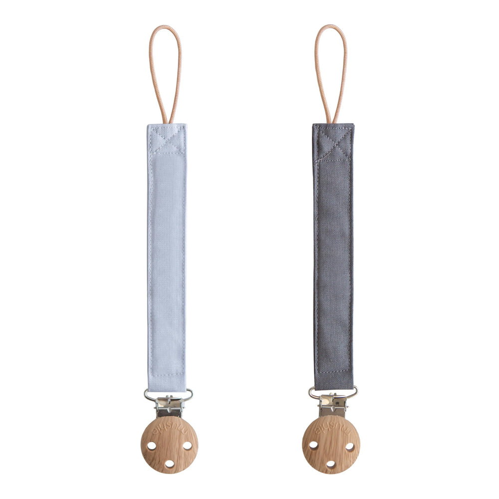 Mushie Linen Pacifier Clip Strap Powder Blue shows soft fabric and easy-on-the-go security