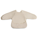 Mushie Long Sleeve Bib Pastel Blooms close-up fabric showing soft, water-resistant surface.