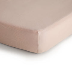 mushie muslin crib sheet blush texture detail highlighting breathable fabric for comfortable naps