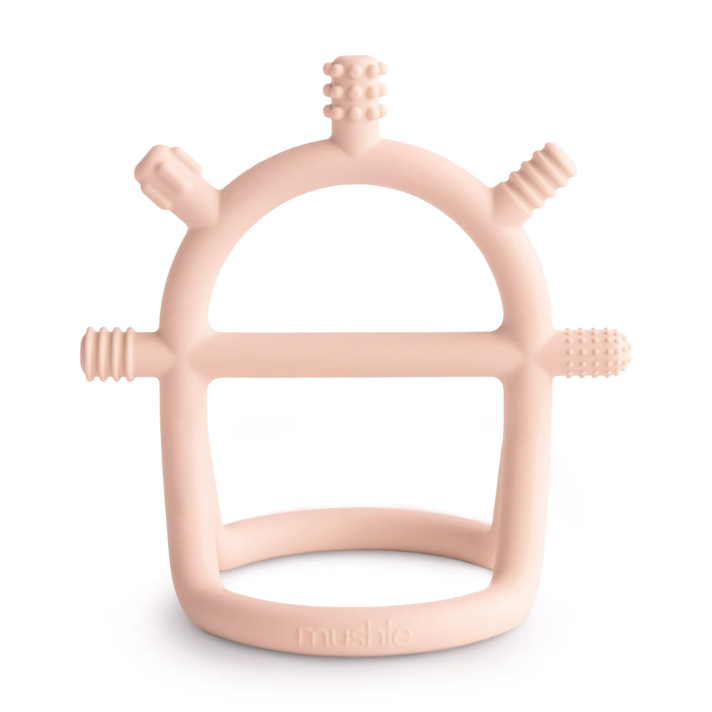 mushie No-Drop teether blush with easy grip handle for tiny hands