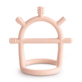 mushie No-Drop teether blush with easy grip handle for tiny hands