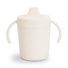 Mushie Trainer Sippy Cup Ivory close-up lid shows leak-resistant design.