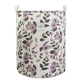 Mziart collapsible floral purple laundry basket shown closed for compact storage.
