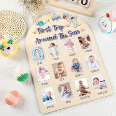 Naozinebi wooden milestone frame hanging in a nursery.