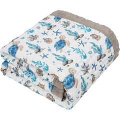 Natchiketa sea turtle muslin blanket fold showcases portable warmth for on-the-go use.