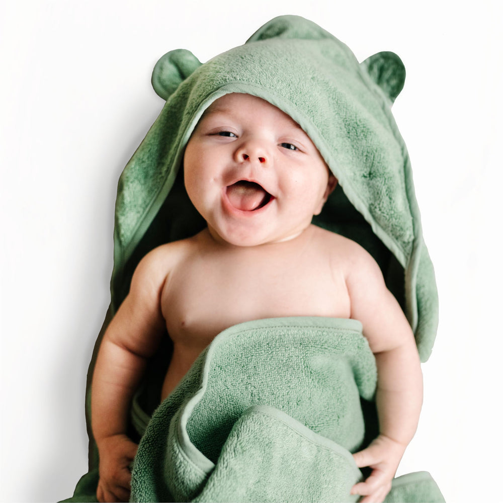 Natemia hooded baby towel folded view highlights compact storage and gifting appeal.