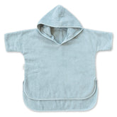 Natemia hooded towel poncho on the beach offers cozy warmth after swimming