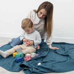 Natemia muslin baby blanket folded display highlights oversized 72x60 size.