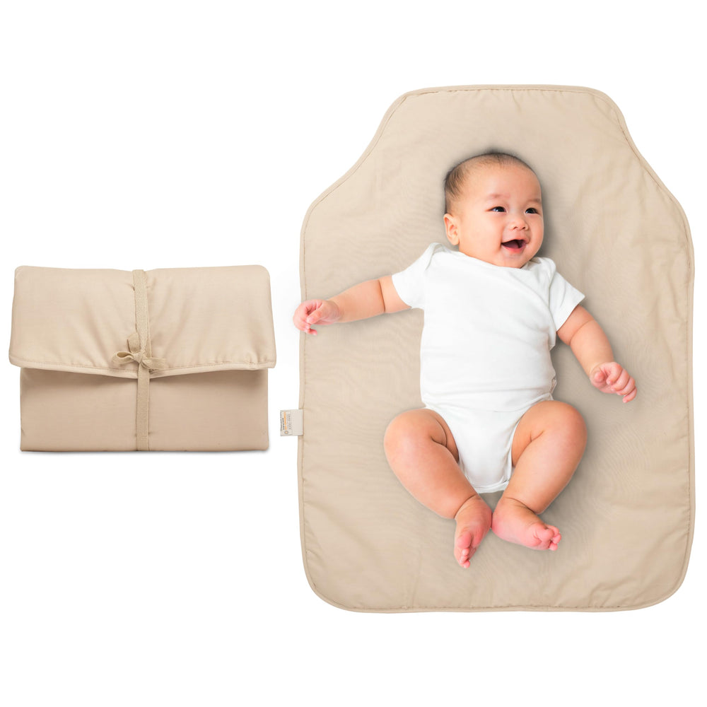 Natemia portable diaper changing pad folded for compact travel and on the go changes.