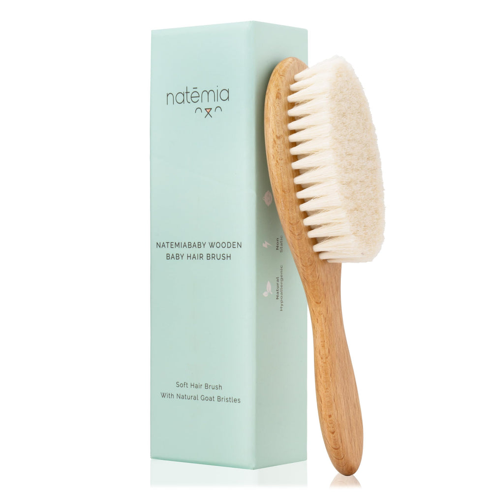 Natemia wooden baby hair brush with goat hair bristles delivering gentle scalp care.