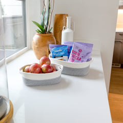 NaturalCozy mid-size rectangle basket used for bathroom towels and supplies.