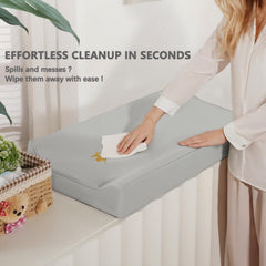 Navari vegan leather changing pad cover uses elastic edges for a secure non-slip fit.
