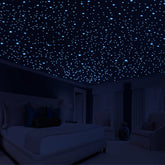 Neasyth glow stars green ceiling dots illuminate a cozy kids' room at night.