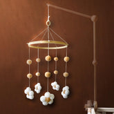 Nerdichic baby crib mobile with felt daisy flowers promotes gentle visual engagement.