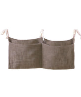 NewLuyer bedside organizer on crib hanging storage keeps baby essentials within reach.