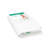 Newton Baby crib mattress spare cover zippered close-up shows breathable fabric for comfort