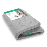 Newton Baby Extra Bassinet Cover gray front view highlighting breathable surface for cool, comfortable naps.