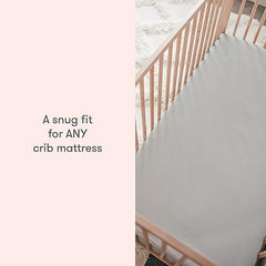 Newton Baby fitted crib sheet demonstrates snug elastic fit on a standard crib mattress