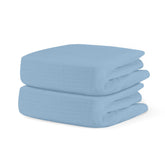 Newton Baby Sky Blue fitted crib sheet fabric close-up shows soft organic cotton.