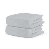 Newton Baby fitted crib sheet Twilight Grey folded on mattress for gentle sleep