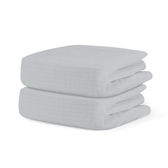 Newton Baby fitted crib sheet Twilight Grey folded on mattress for gentle sleep